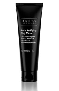The image shows a sleek black tube of Revision Skincare's Pore Purifying Clay Mask. Its label indicates it's for dual cleansing and refining treatment.