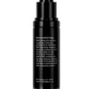 This is an image of a black skincare product bottle with a pump dispenser. It has white text detailing the recommended usage instructions and manufacturing information.