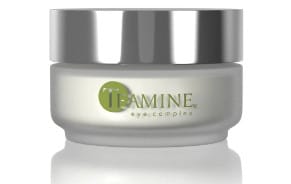 This image shows a container of cream labeled "IBAMINE," set against a white background. It has a silver lid and the brand is highlighted in green.