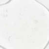 This image shows a blob of clear, viscous liquid with bubbles, possibly a skincare product like serum, gel, or cosmetic substance, evenly spread on a white surface.