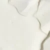 The image displays a creamy, white textured surface with soft curves and gentle folds, creating an abstract and smooth visual. It appears velvety and soft.