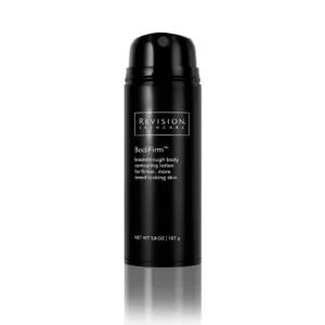 The image shows a sleek black bottle of Revision Skincare BodiFirm, a contouring lotion aimed at creating firmer, more toned-looking skin, against a white background.
