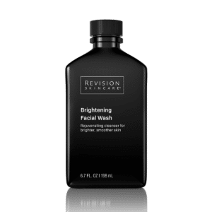 This is an image of a black bottle labeled "Revision Skincare Brightening Facial Wash" for brighter, smoother skin, containing 6.7 FL. OZ (198 mL).