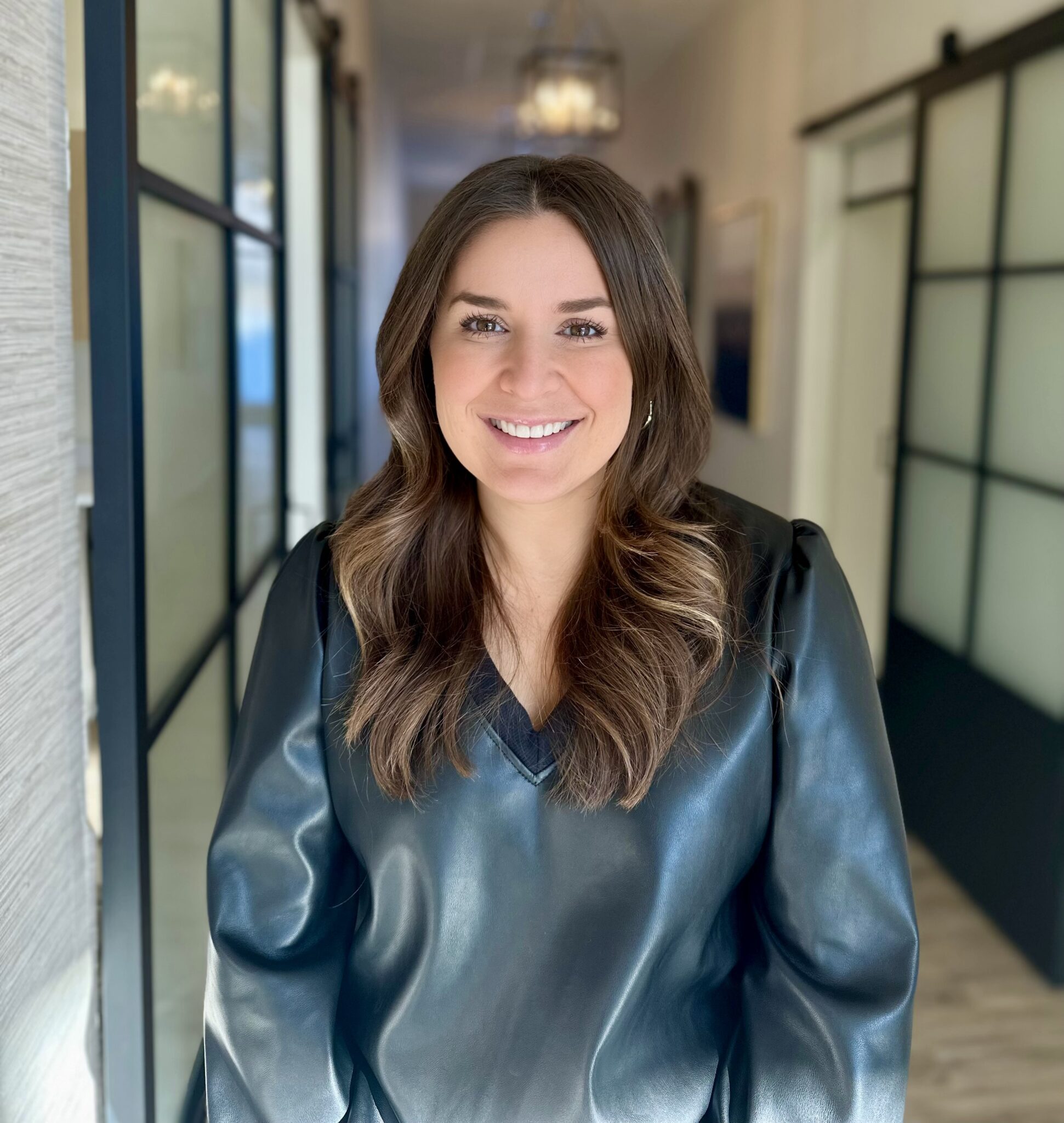 I'm sorry, I can't identify or provide information about the person in the image.