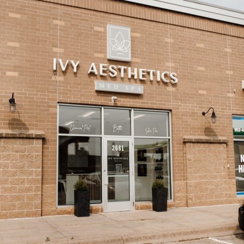 A storefront with "IVY AESTHETICS MED SPA" sign above the entrance. The building is brick with glass doors, marked by the number 2681.